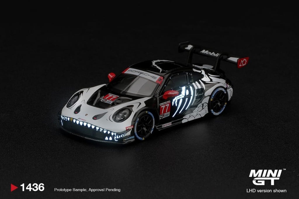 MINI GT Porsche 911 GT3 R (992) #77 AO Racing "Skeleton Rexy" 2026 IMSA Petit Le Mans (Glow in the Dark)