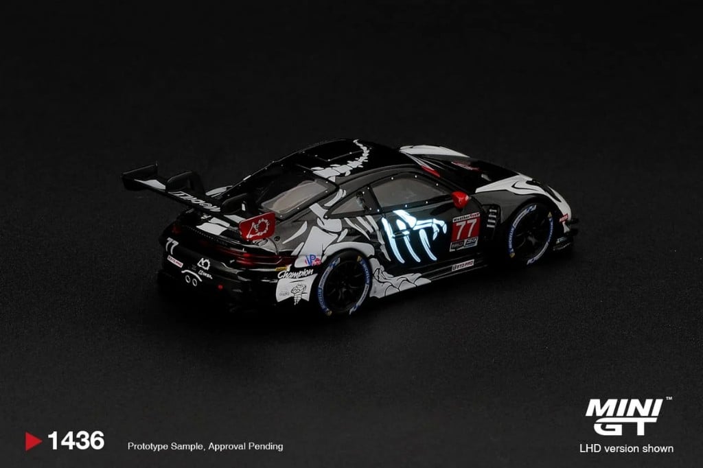 MINI GT Porsche 911 GT3 R (992) #77 AO Racing "Skeleton Rexy" 2026 IMSA Petit Le Mans (Glow in the Dark) photo 3